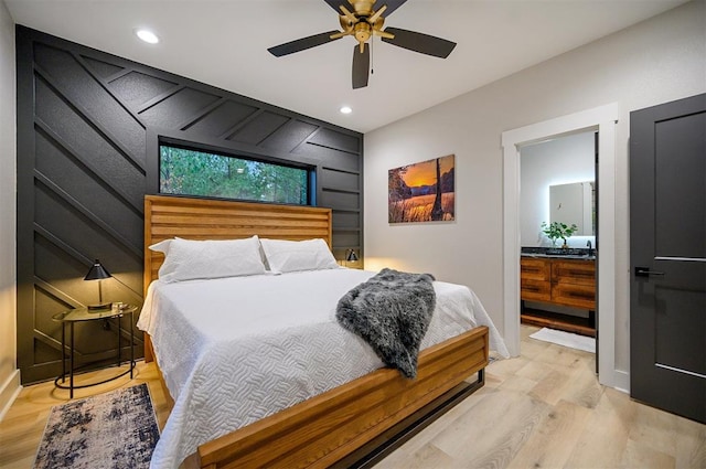 bedroom with light wood-type flooring and ceiling fan