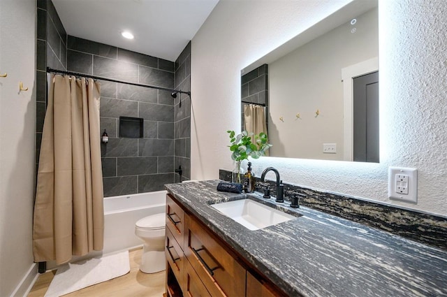 full bathroom featuring toilet, vanity, shower / bath combination with curtain, and hardwood / wood-style flooring