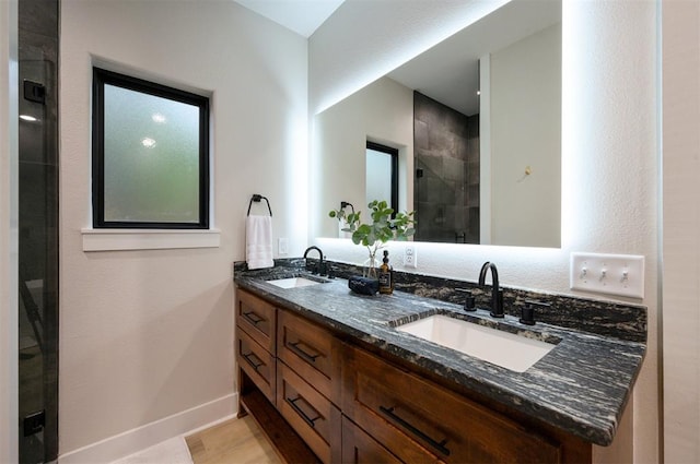 bathroom with vanity and an enclosed shower