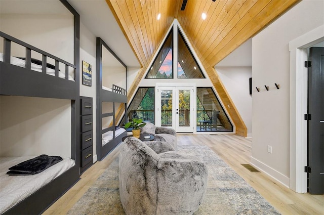 living room with french doors, high vaulted ceiling, wooden ceiling, and light wood-type flooring