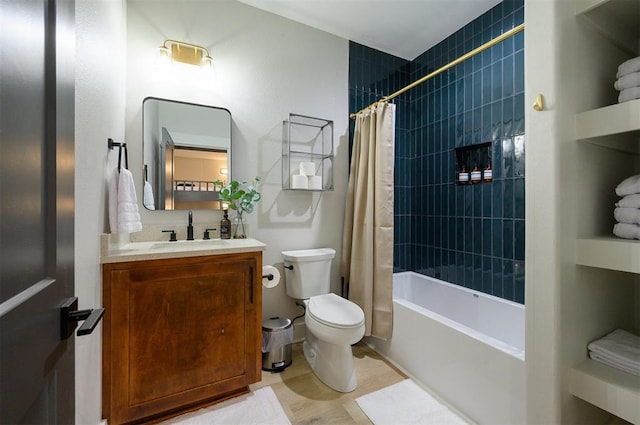 full bathroom with vanity, shower / bath combo, and toilet