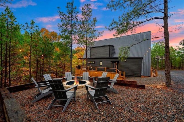 exterior space featuring an outdoor fire pit