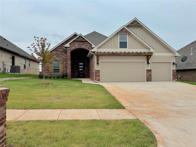 craftsman-style house featuring central AC unit and a front lawn