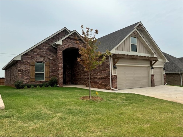 view of front of home featuring a garage and a front lawn