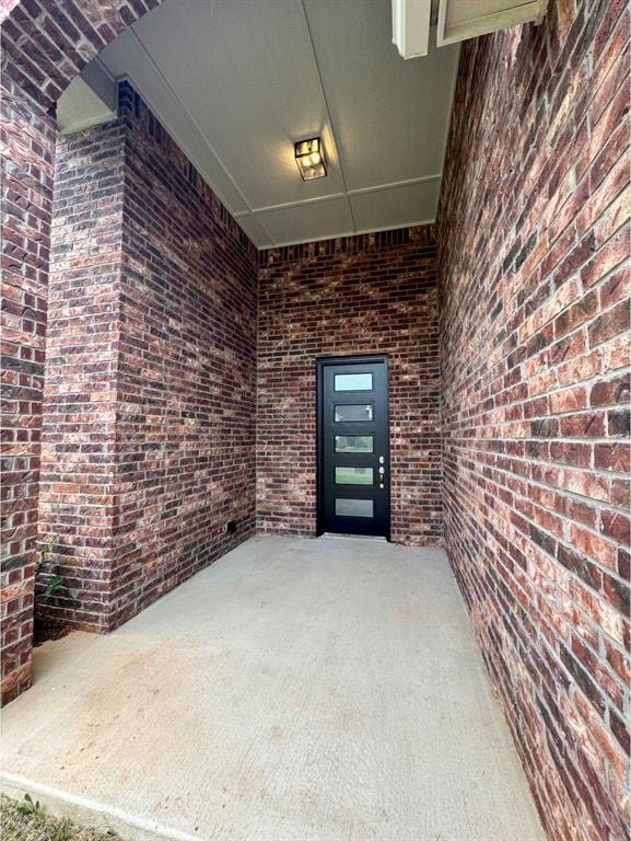 entrance to property with a patio area