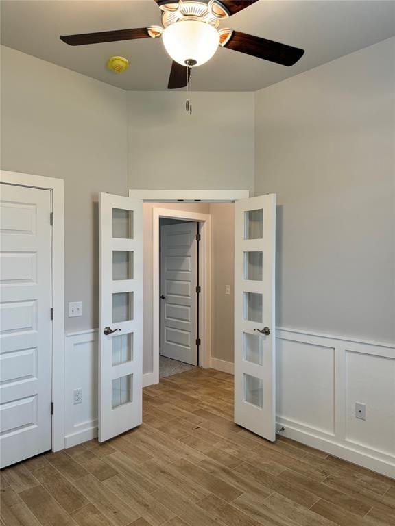 spare room featuring light hardwood / wood-style floors and ceiling fan