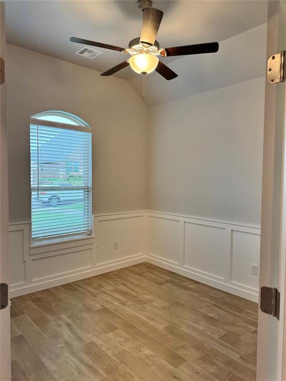 spare room with ceiling fan and light hardwood / wood-style floors