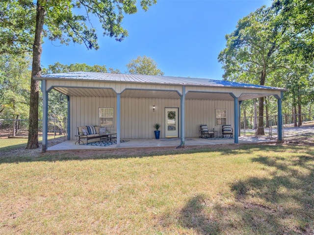 view of outbuilding featuring a lawn