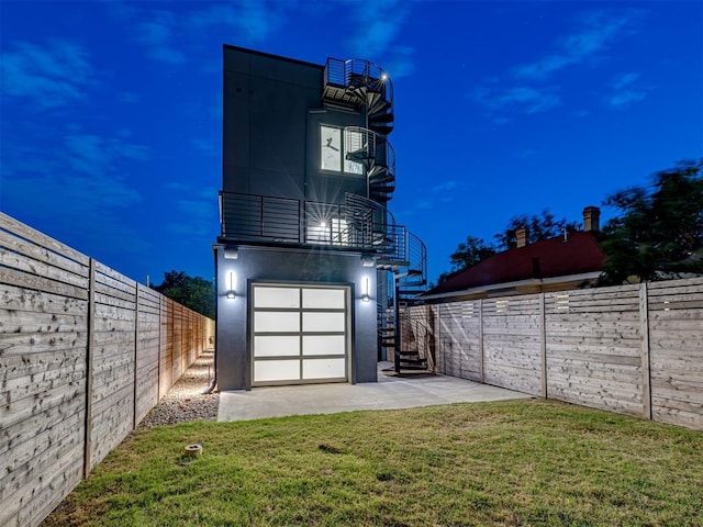 exterior space featuring a balcony and a yard