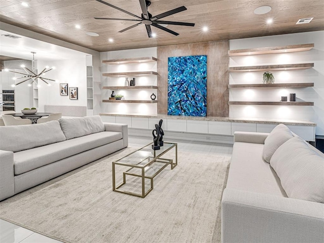 living room with ceiling fan with notable chandelier, built in shelves, light wood-type flooring, and wood ceiling