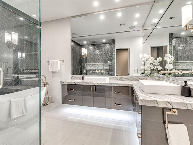 bathroom with tile patterned floors, vanity, and independent shower and bath