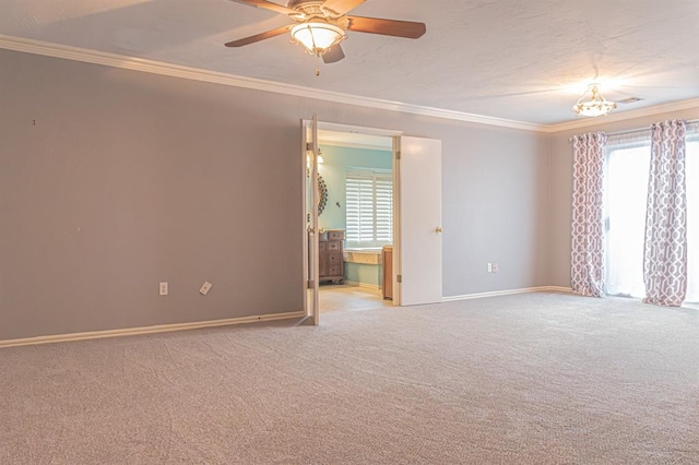 empty room featuring light carpet, ceiling fan, and ornamental molding