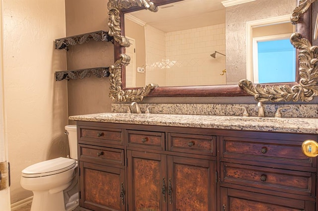 bathroom with a shower, toilet, and vanity