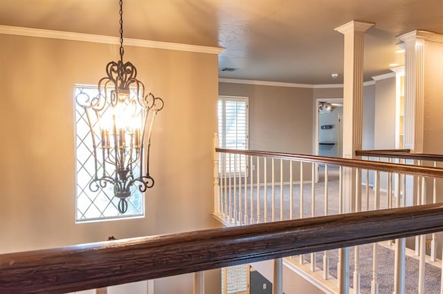 interior details with crown molding and decorative columns