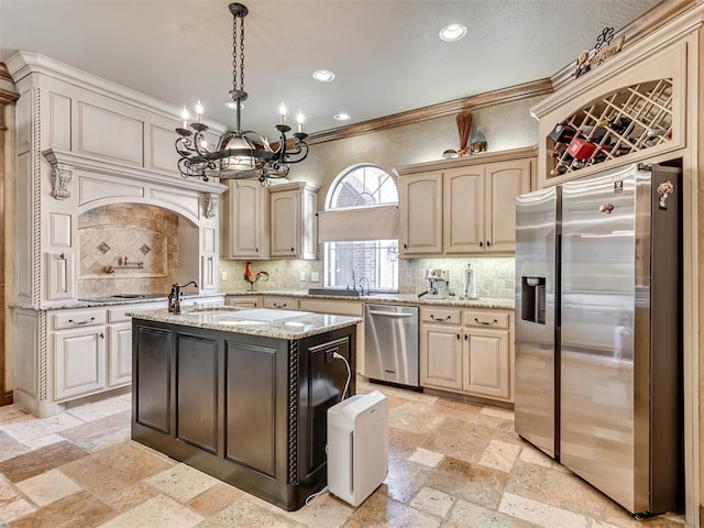 kitchen with decorative backsplash, a kitchen island, stainless steel appliances, and hanging light fixtures