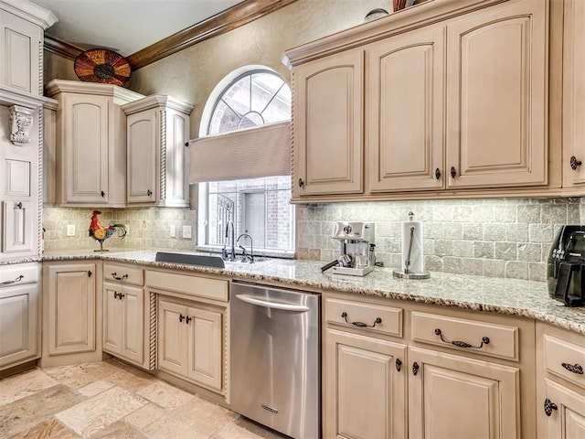 kitchen featuring dishwasher, sink, light stone counters, crown molding, and decorative backsplash