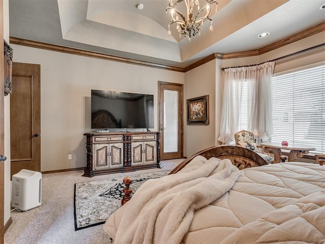 bedroom with a tray ceiling, crown molding, and light colored carpet