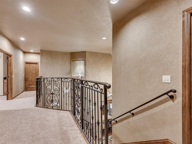 hallway with light carpet