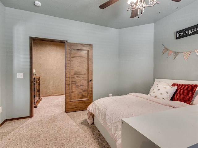 bedroom with light colored carpet and ceiling fan