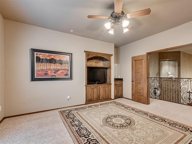 living room featuring ceiling fan and carpet floors