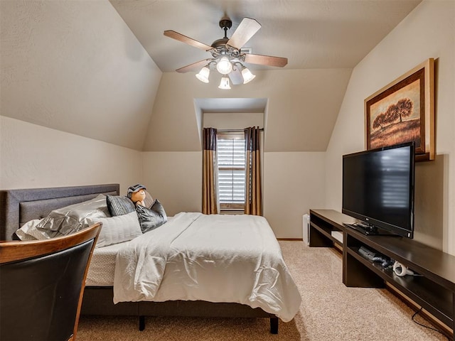 bedroom featuring light carpet, vaulted ceiling, and ceiling fan