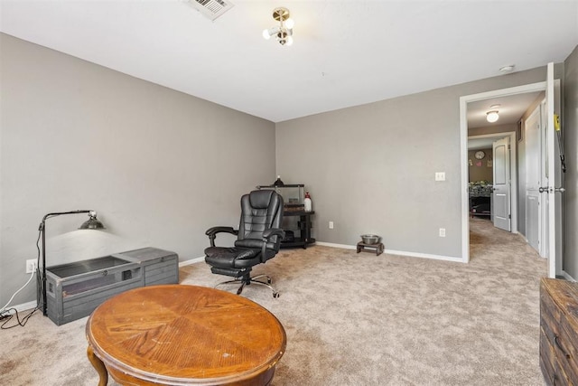 living area featuring light colored carpet