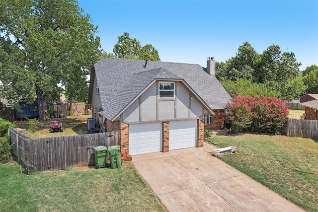 view of front of home with a garage and a front lawn