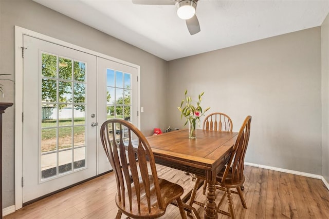 dining room featuring ceiling fan, french doors, and light hardwood / wood-style flooring