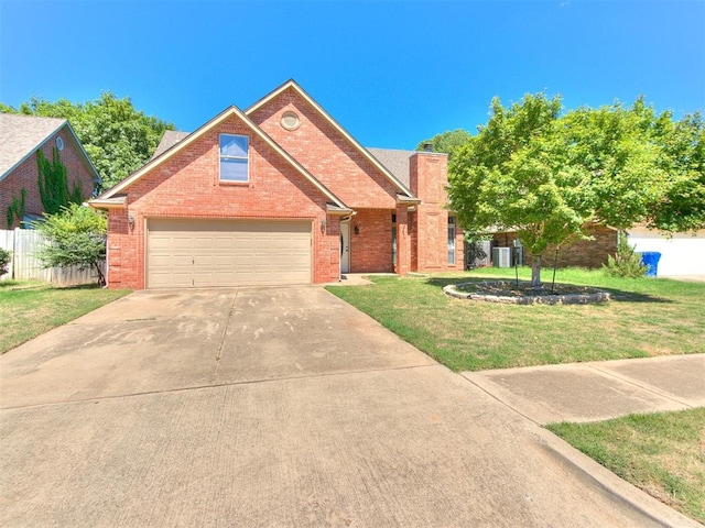 view of front property with a front lawn and a garage