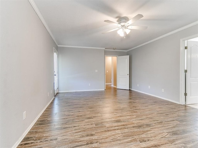 spare room with hardwood / wood-style flooring, ceiling fan, and ornamental molding