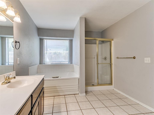 bathroom with vanity, plenty of natural light, tile patterned floors, and separate shower and tub