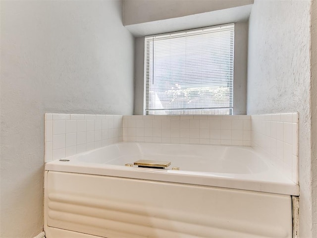 bathroom with a tub