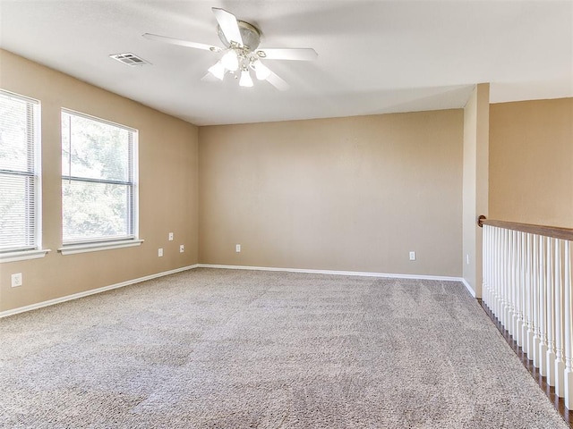 unfurnished room featuring carpet flooring and ceiling fan