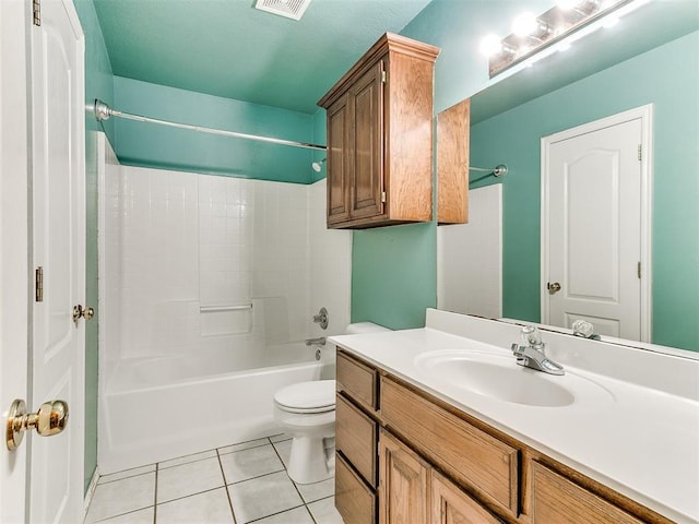 full bathroom with shower / tub combination, tile patterned floors, toilet, and vanity