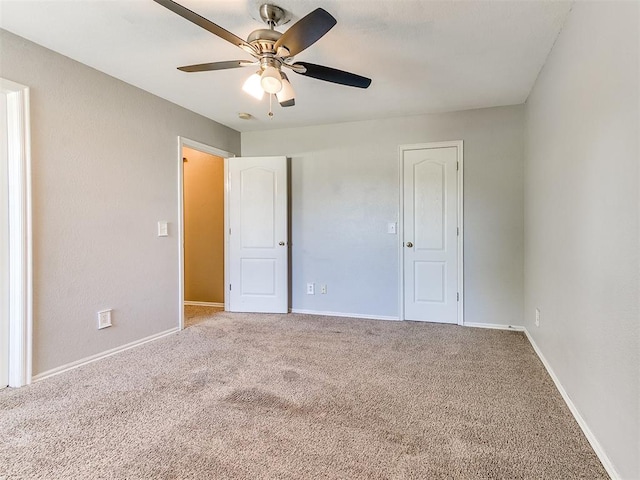 unfurnished bedroom with carpet floors and ceiling fan