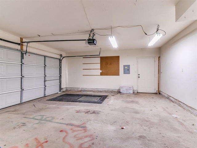 garage with electric panel and a garage door opener