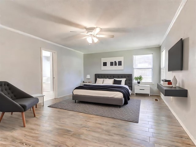 bedroom featuring hardwood / wood-style flooring, ceiling fan, ornamental molding, and connected bathroom