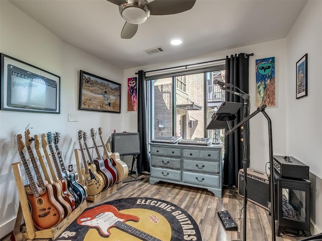 interior space with ceiling fan and hardwood / wood-style floors