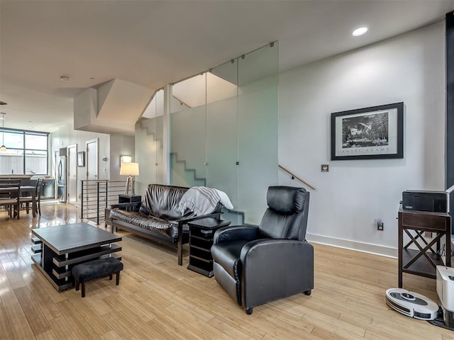 living room with light hardwood / wood-style flooring