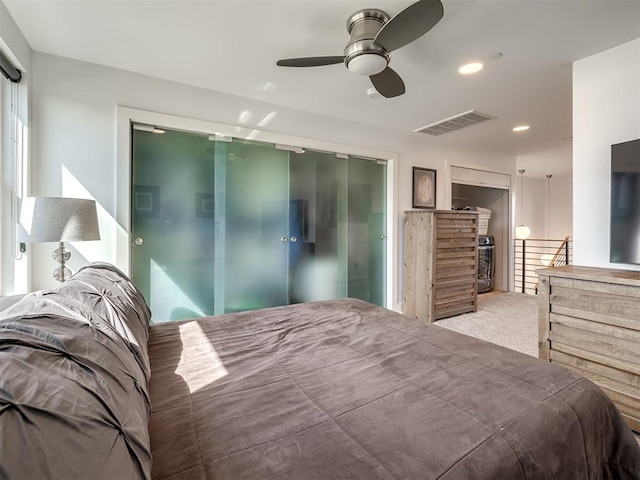 bedroom featuring ceiling fan and carpet