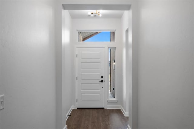 doorway with dark hardwood / wood-style floors