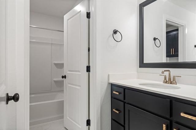 bathroom with vanity and shower / washtub combination