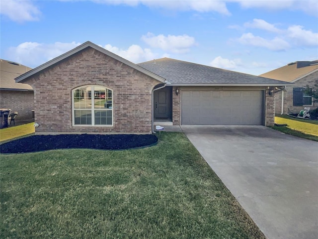 ranch-style house featuring a front yard and a garage