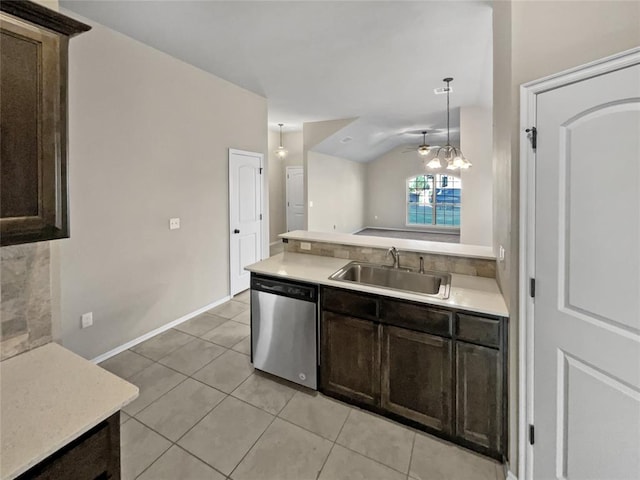 kitchen featuring dishwasher, light tile patterned floors, hanging light fixtures, and sink