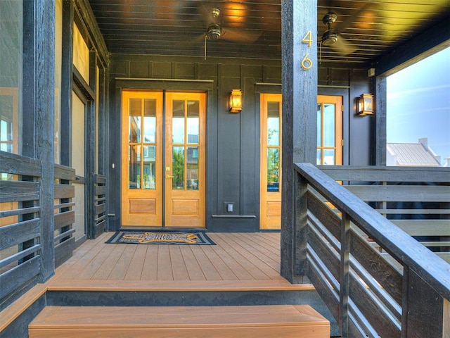 view of exterior entry featuring covered porch