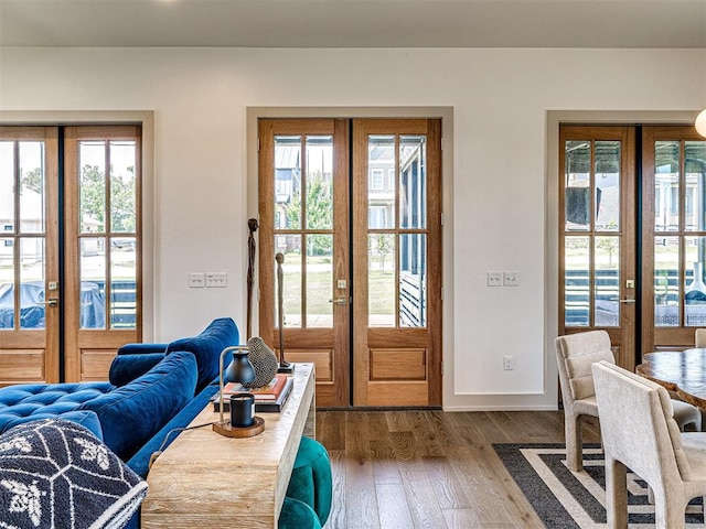 doorway to outside with french doors and hardwood / wood-style floors