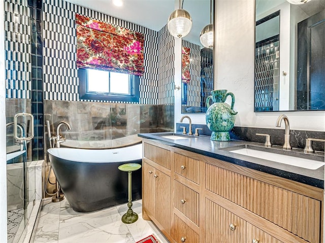 bathroom with a tub and vanity