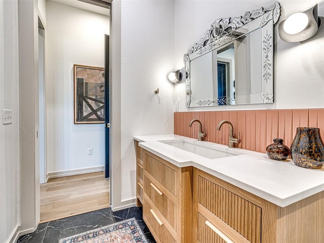 bathroom featuring hardwood / wood-style flooring and vanity