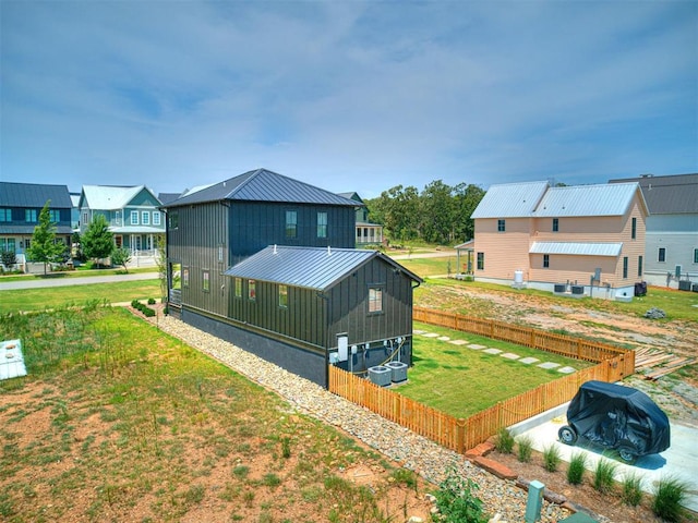 rear view of house with a lawn