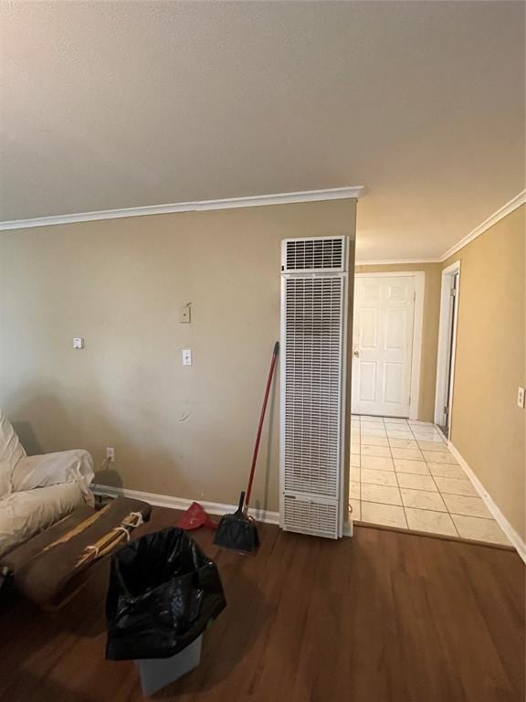 interior space featuring light wood-type flooring and ornamental molding